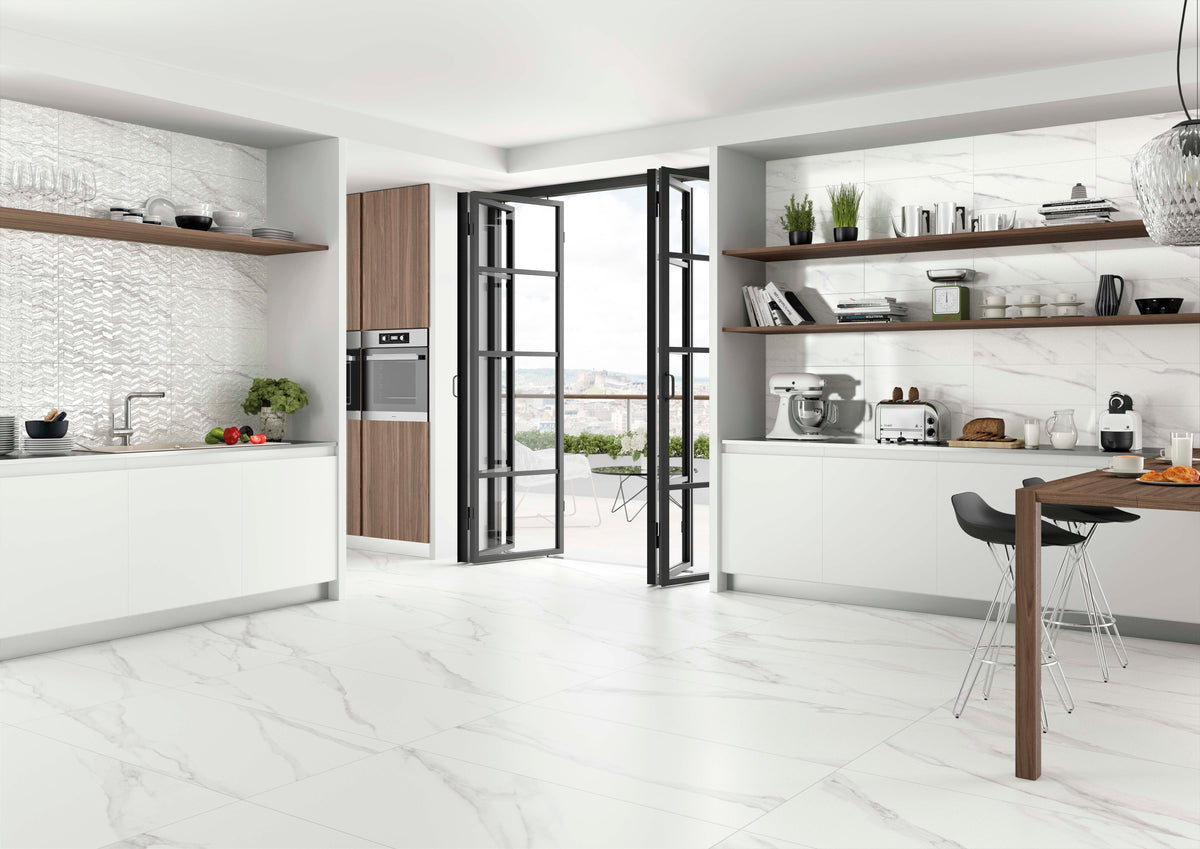 Modern kitchen with white cabinets, marble countertops, and a Spanish ceramic white tile backsplash
