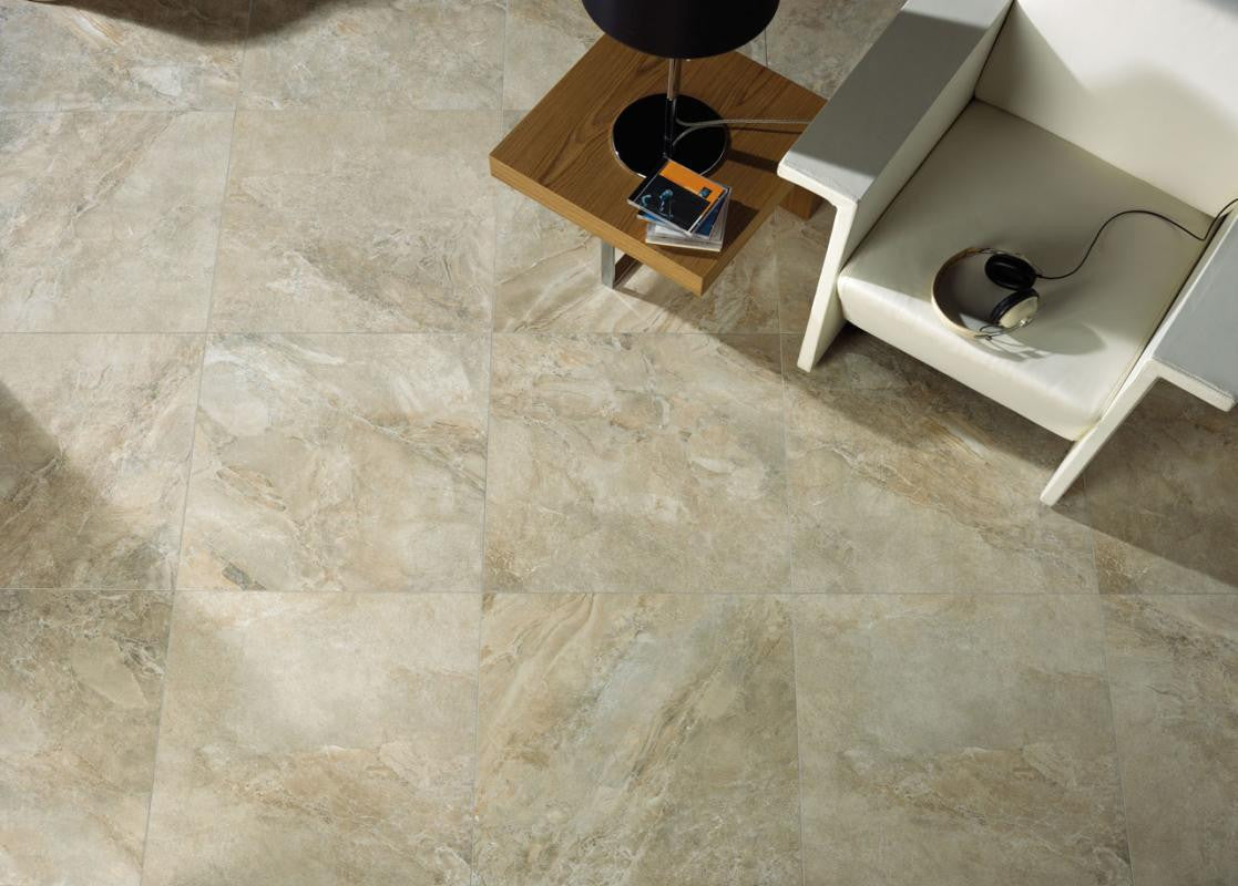 Icaria Beige stone-look porcelain living floor — porcelain that reads like stone without a sealing schedule