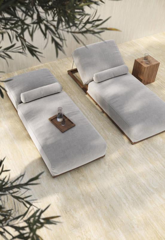 Lounge chairs on travertine look beige tile