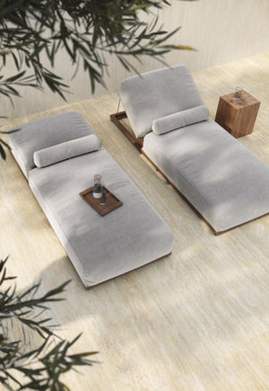 Lounge chairs on travertine look beige tile