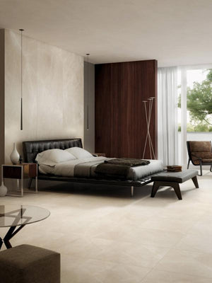 Modern bedroom with a bed, nightstands, and a large window with seamless tile wall and floor from large porcelain panels.