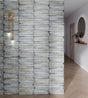 Delta Sky Glossy 5x13 ceramic wall tile shown in a hallway setting