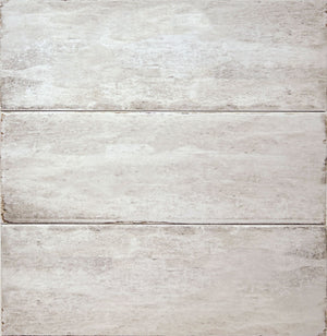 Delta Beige Glossy 5x13 ceramic wall tile, close-up of three pieces showing the glossy beige glaze